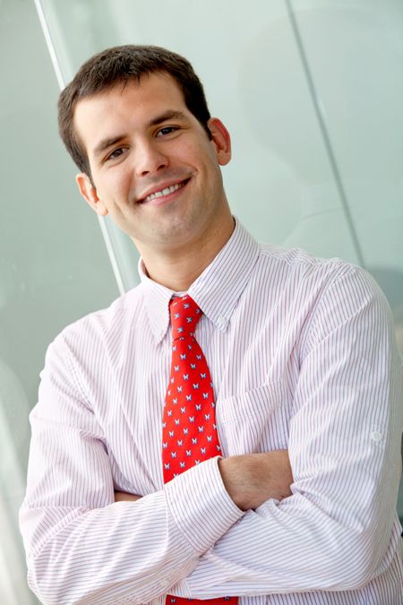 Business man portrait smiling at the office