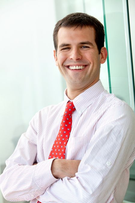 Business man portrait smiling at the office