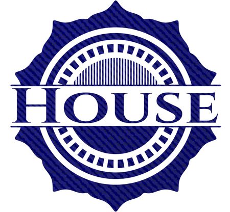 House badge with denim background