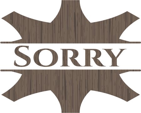 Sorry badge with wooden background