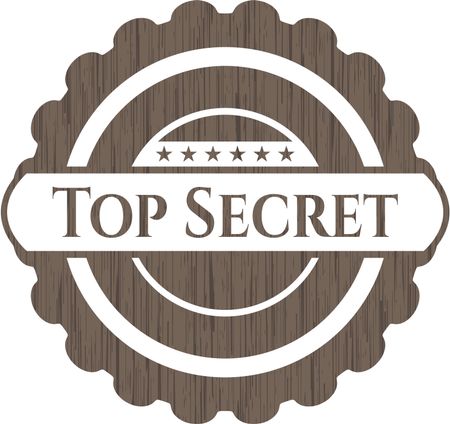 Top Secret badge with wooden background
