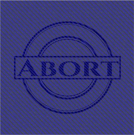Abort emblem with jean background