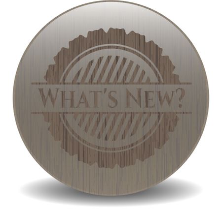 What's New? badge with wooden background