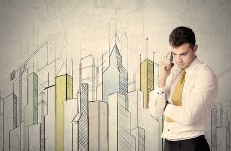 A young adult businessman standing in front of a wall with colorful drawings of buildings, charts, graphs, signs