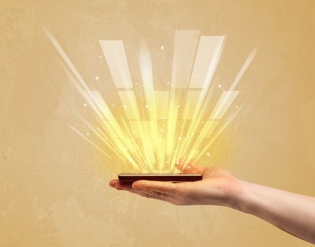 A caucasian hand holding a tablet phone with light beams and information escaping the device illustration concept