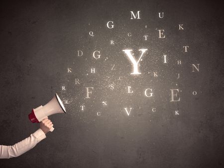 Caucasian arm holding megaphone with letter cloud