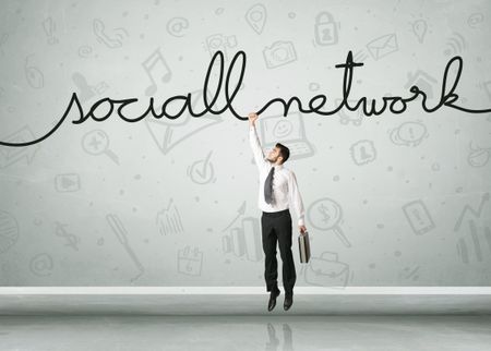 Businessman hanging on a social network rope
