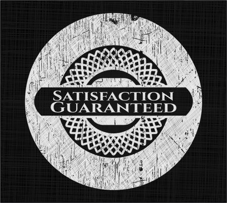 Satisfaction Guaranteed chalk emblem written on a blackboard