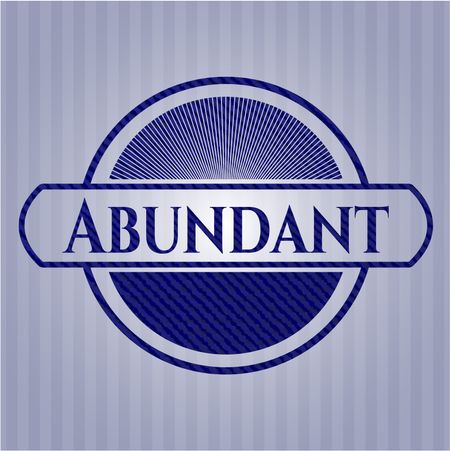 Abundant badge with denim background