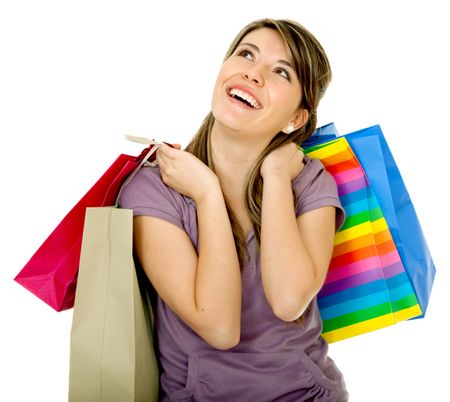 Pensive shopping girl isolated over a white background