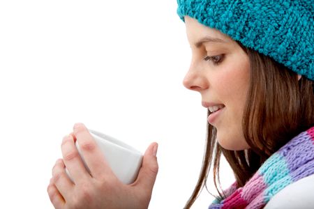 Winter woman drinking hot chocolate isolated over a white background