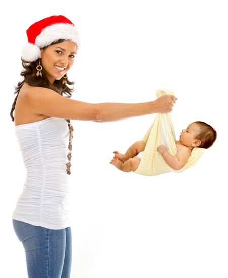 Christmas woman holding a baby isolated over a white background