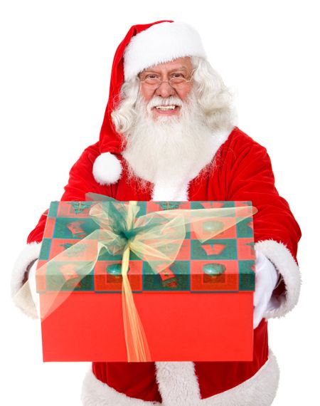 Santa holding a gift isolated over a white background