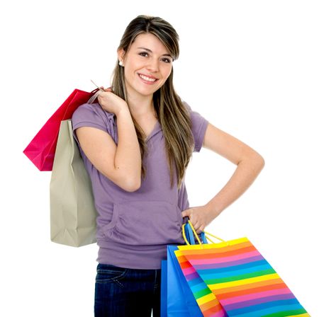 Shopping woman smiling isolated over a white background