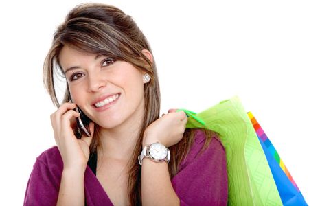 Shopping woman on the phone isolated over a white background