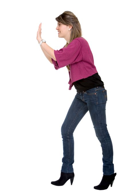 woman pushing something imaginary isolated over a white background
