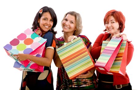 Happy shopping women with bags isolated over a white background