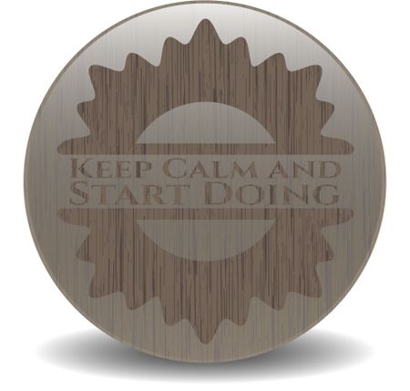 Keep Calm and Start Doing badge with wood background