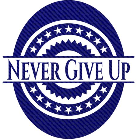 Never Give Up badge with denim background