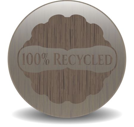 100% Recycled badge with wood background