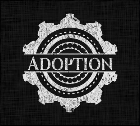 Adoption chalk emblem written on a blackboard