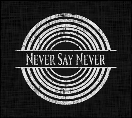 Never Say Never written on a chalkboard