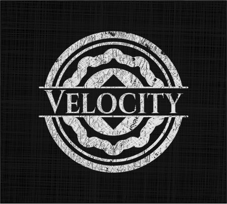 Velocity written on a chalkboard