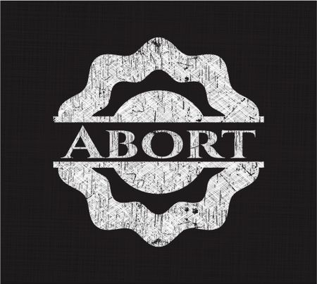 Abort chalkboard emblem on black board