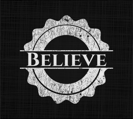 Believe chalkboard emblem written on a blackboard