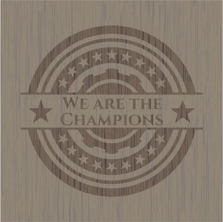 We are the Champions badge with wooden background
