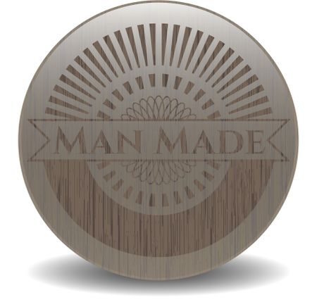 Man Made badge with wooden background