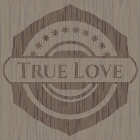 True Love badge with wooden background