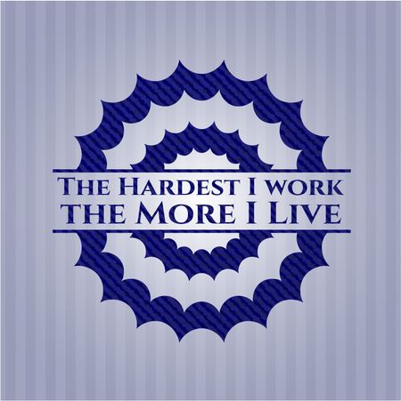 The Hardest I work the More I Live emblem with jean background