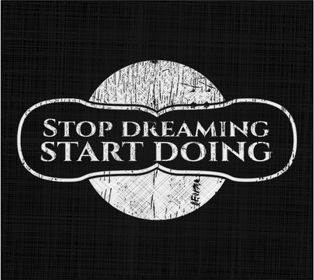 Stop dreaming start doing on chalkboard