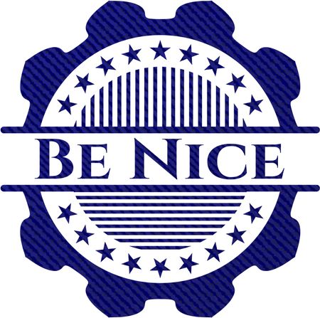 Be Nice badge with denim background