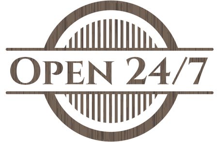Open 24/7 badge with wood background