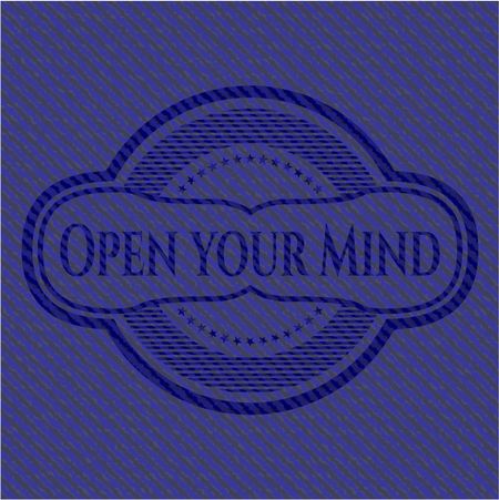 Open your Mind emblem with jean background
