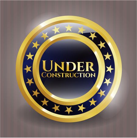 Under Construction gold emblem