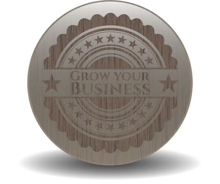 Grow your Business badge with wooden background