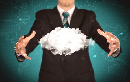 Elegant business person holding an empty white cloud in its hands in front of green wall background with world map illustration concept