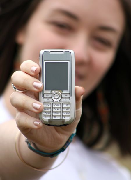 beautiful woman holding a mobile phone