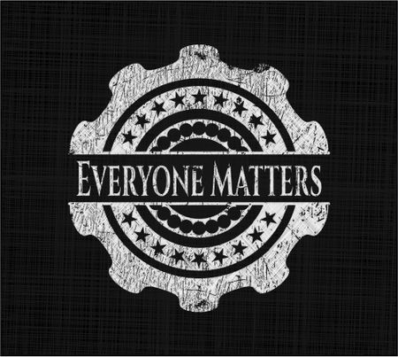 Everyone Matters chalkboard emblem written on a blackboard