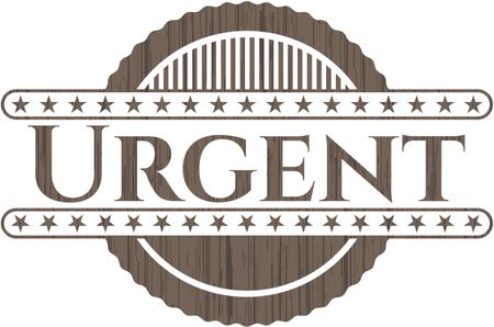 Urgent badge with wooden background