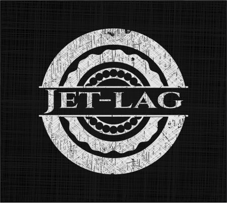 Jet-lag chalkboard emblem on black board