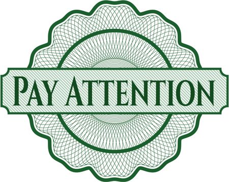 Pay Attention written inside rosette