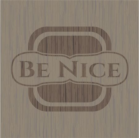 Be Nice badge with wooden background