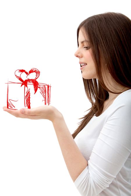 Girl holding a gift on her hand isolated on white