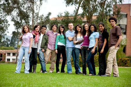 Group of students together looking happy outdoors