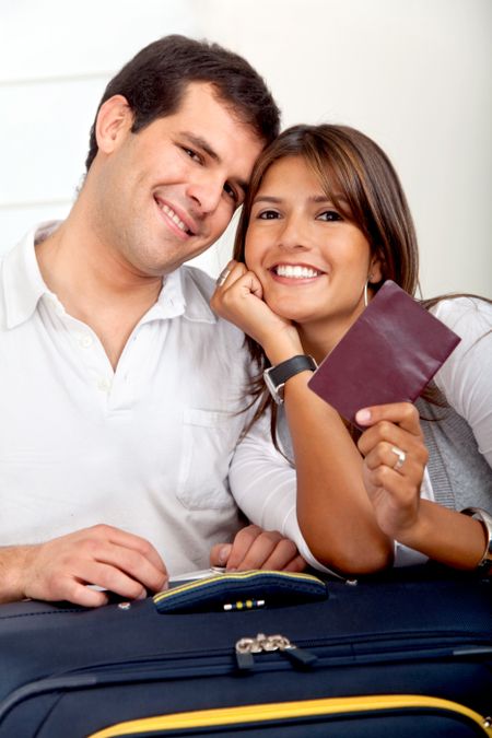 Beautiful happy couple waiting for a trip