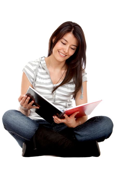 Pretty student studying isolated over a white background